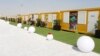  دوہا قطر میں ،نومبر دوہزار بائیس ورلڈ کپ کے لئے بنائے جانے والے موبائل گھر ،جو اب زلزلہ زدگان کو بطور عطیہ بھیجے جارہے ہیں 